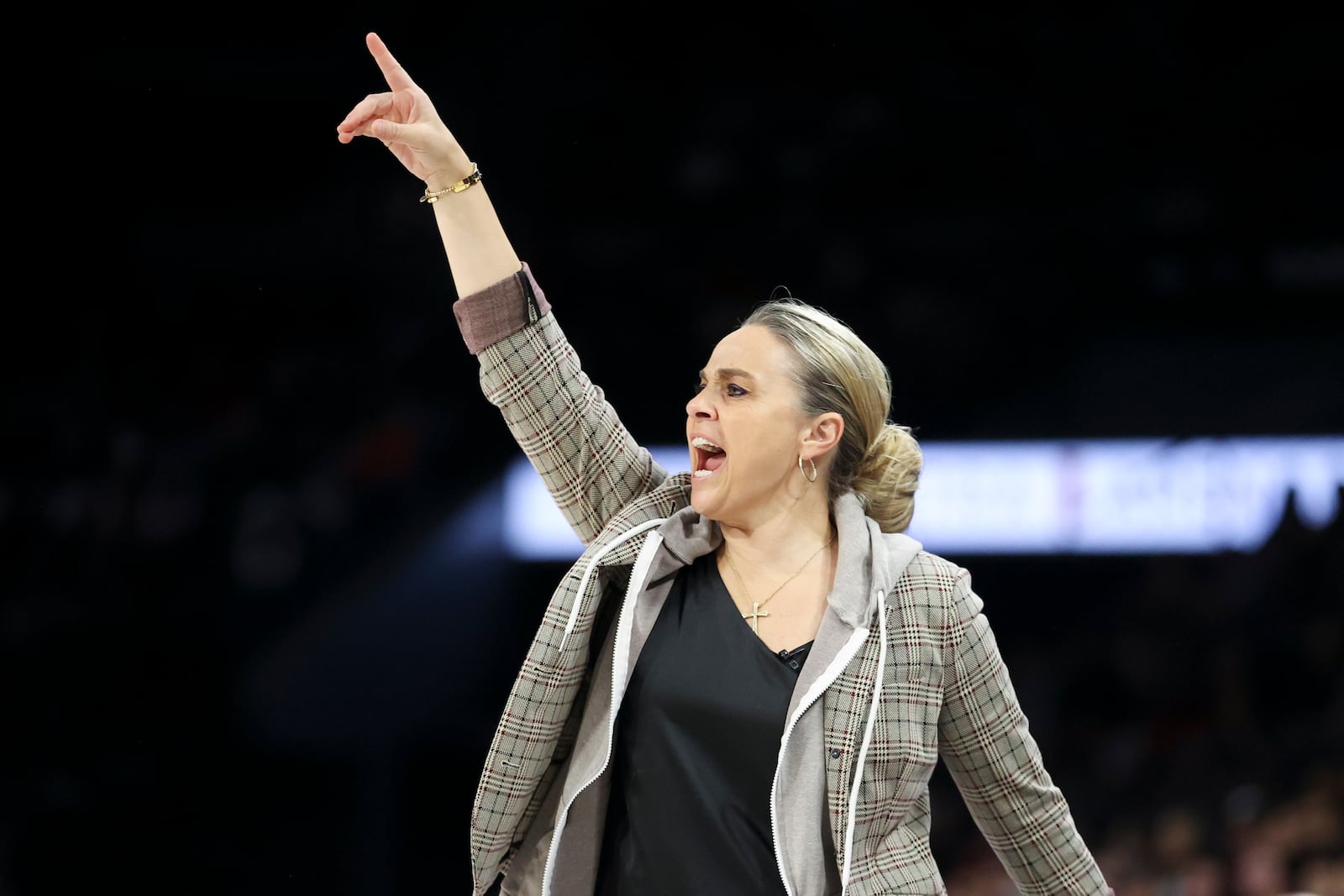 Las Vegas Aces head coach Becky Hammon yells during the first half of a WNBA Semifinal game against the New York Liberty, Sunday, Oct. 6, 2024, in Las Vegas. (AP Photo/Ian Maule)