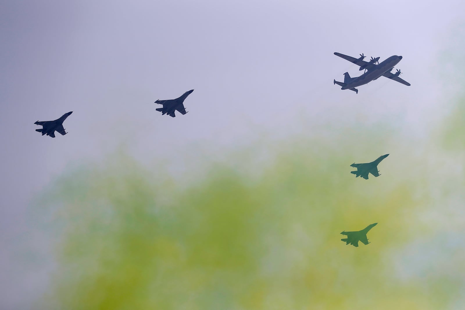 FILE - Chinese military aircraft fly in formation during a parade to commemorate the 70th anniversary of the founding of Communist China in Beijing, Tuesday, Oct. 1, 2019. (AP Photo/Mark Schiefelbein, File)