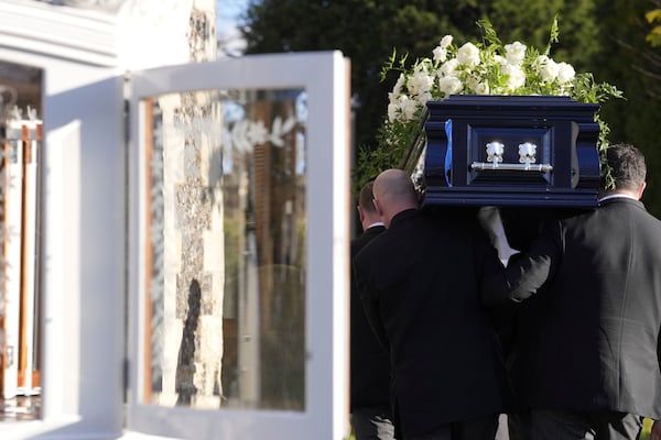 Liam Payne's coffin is carried into the funeral service for the One Direction singer at St Mary's Church in Amersham, Buckinghamshire, England, Wednesday Nov. 20, 2024. (Andrew Matthews/PA via AP)