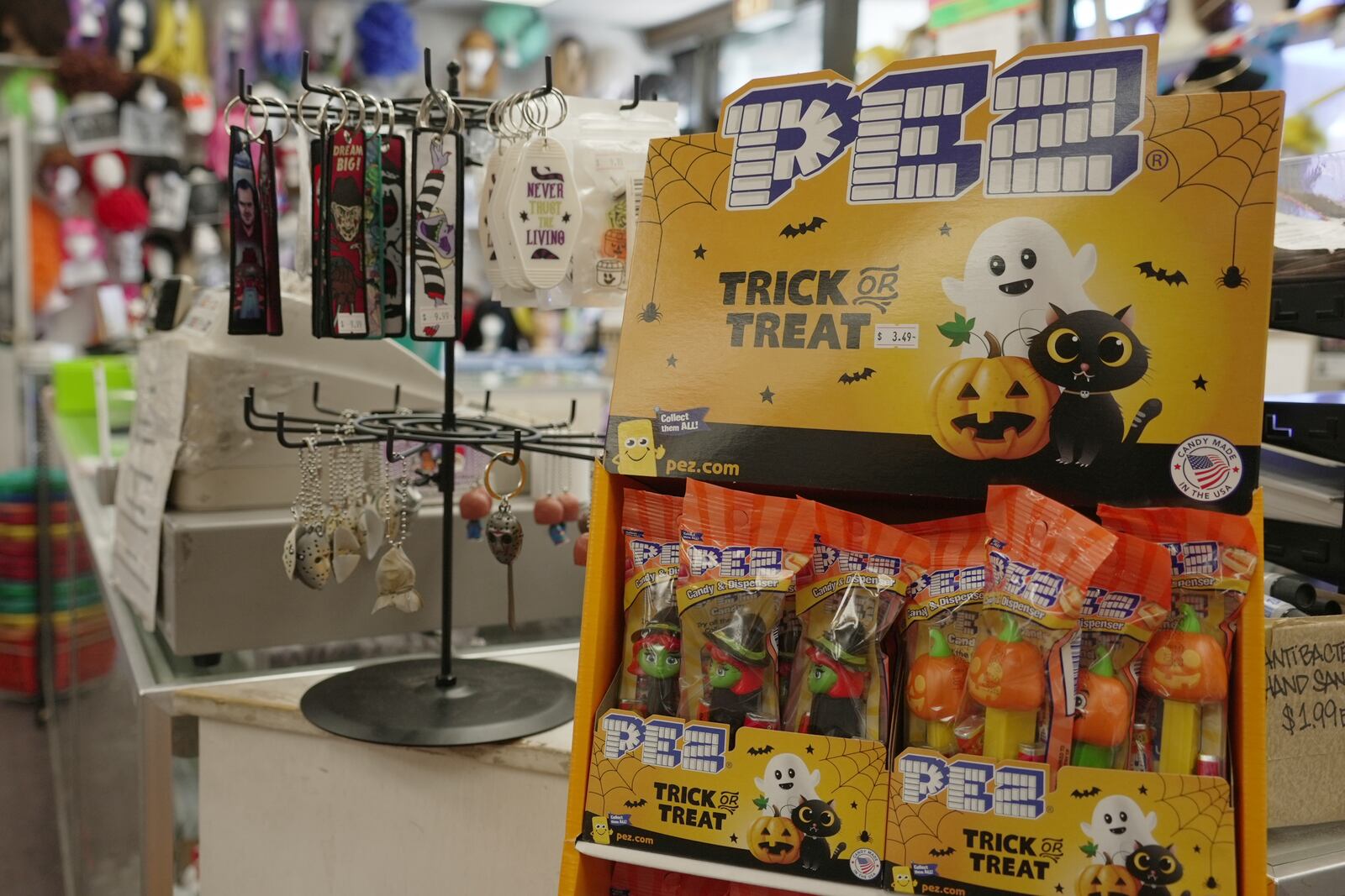 Candy and Halloween trinkets sit on the counter at a store in Chicago on Oct. 8, 2024. (AP Photo/Laura Bargfeld)