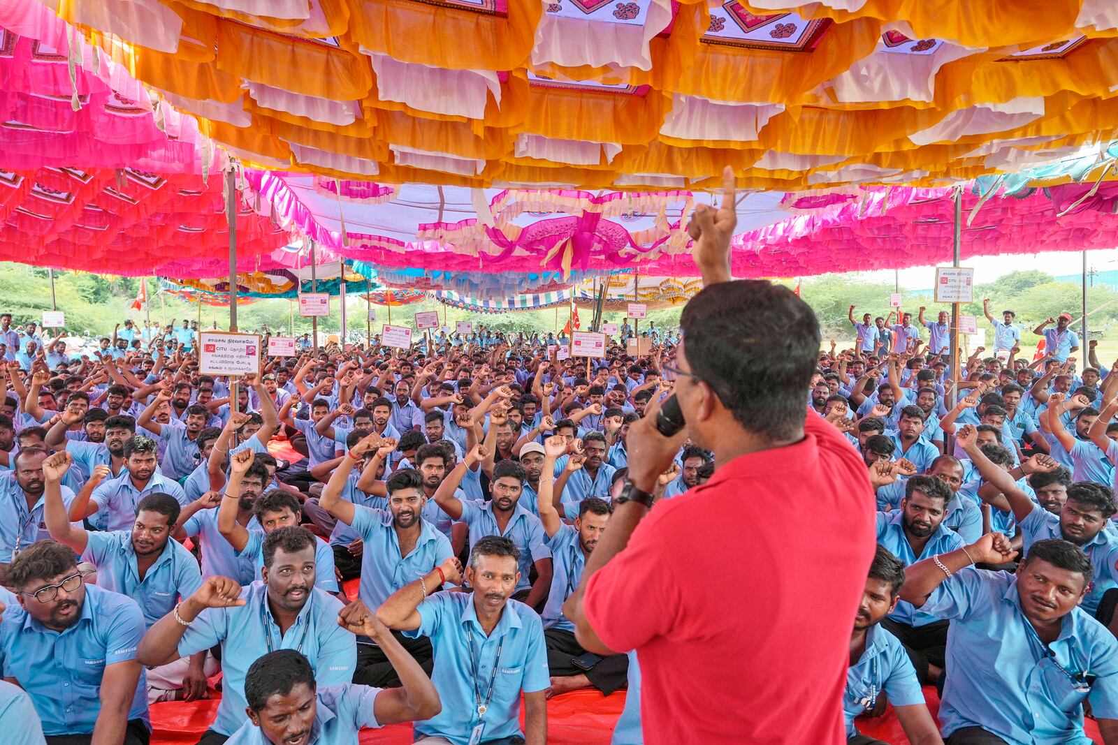 Samsung workers who are on strike shout slogans during a protest near their plant in Sriperumbudur, on the outskirts of Chennai, India, Tuesday, Sept. 24, 2024. (AP Photo/Mahesh Kumar A.)