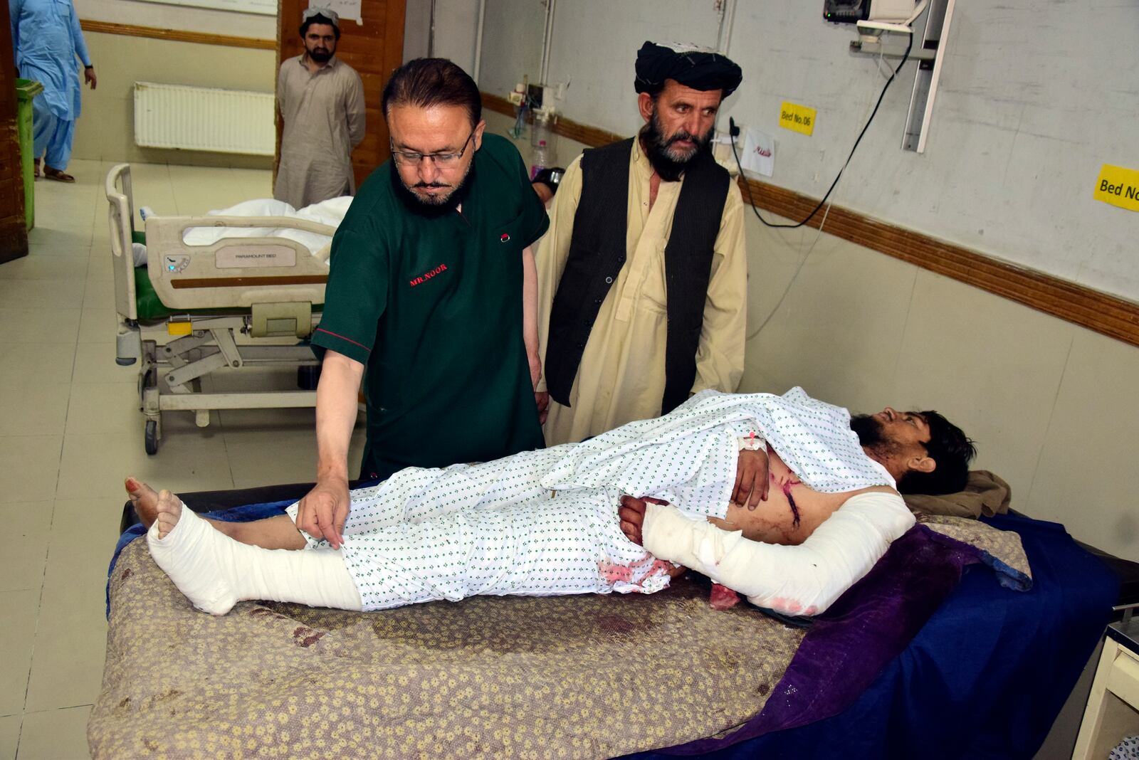 An injured man receives treatment at a hospital in Quetta, Pakistan, Friday, Oct. 11, 2024, following Thursday night's attack by gunmen in Balochistan province. (AP Photo/Arshad Butt)