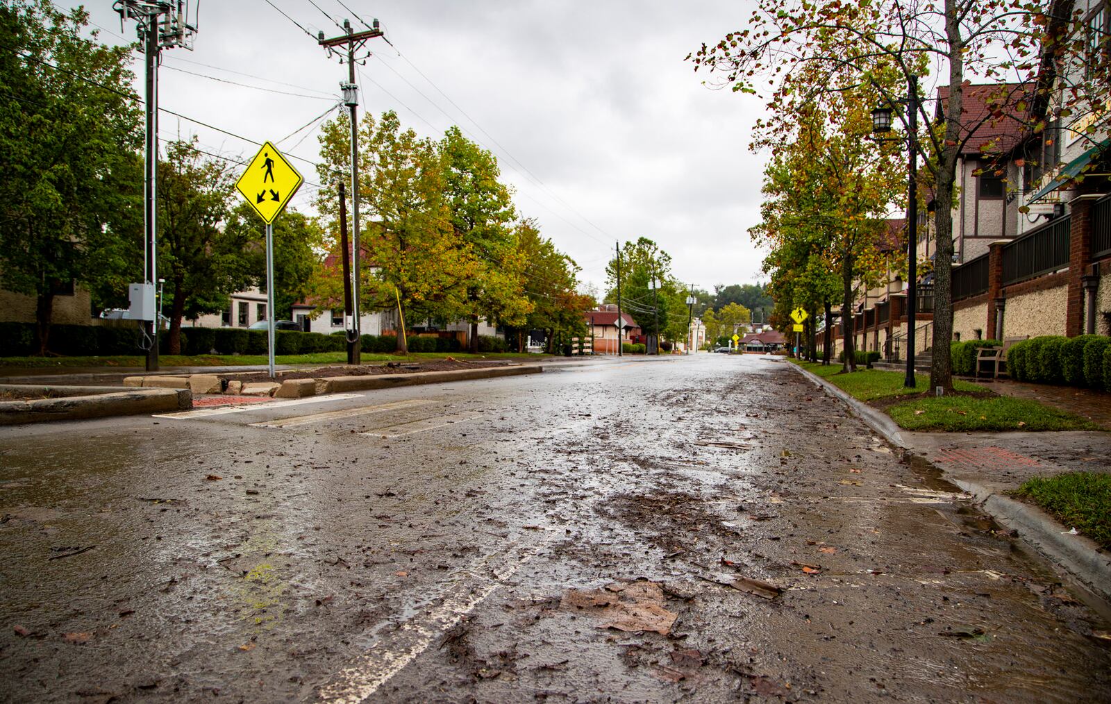 Debris litters Hendersonville Road in Historic Biltmore Village in Asheville, N.C. on Friday, Sept. 27, 2024. (Josh Bell/The Asheville Citizen-Times via AP)