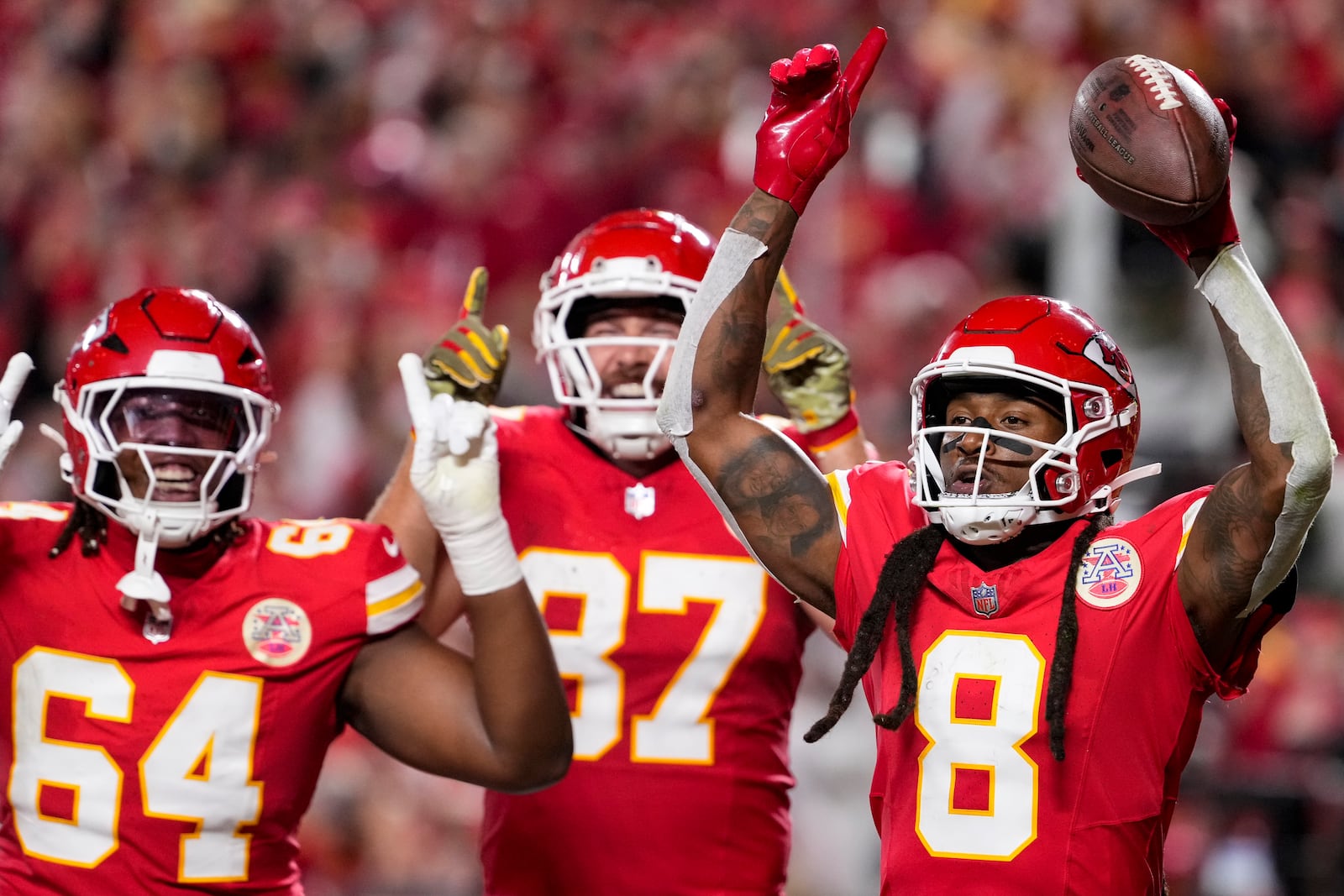 Kansas City Chiefs wide receiver DeAndre Hopkins (8) celebrates his touchdown in the end zone against the Tampa Bay Buccaneers during the first half of an NFL football game, Monday, Nov. 4, 2024, in Kansas City, Mo. (AP Photo/Ed Zurga)