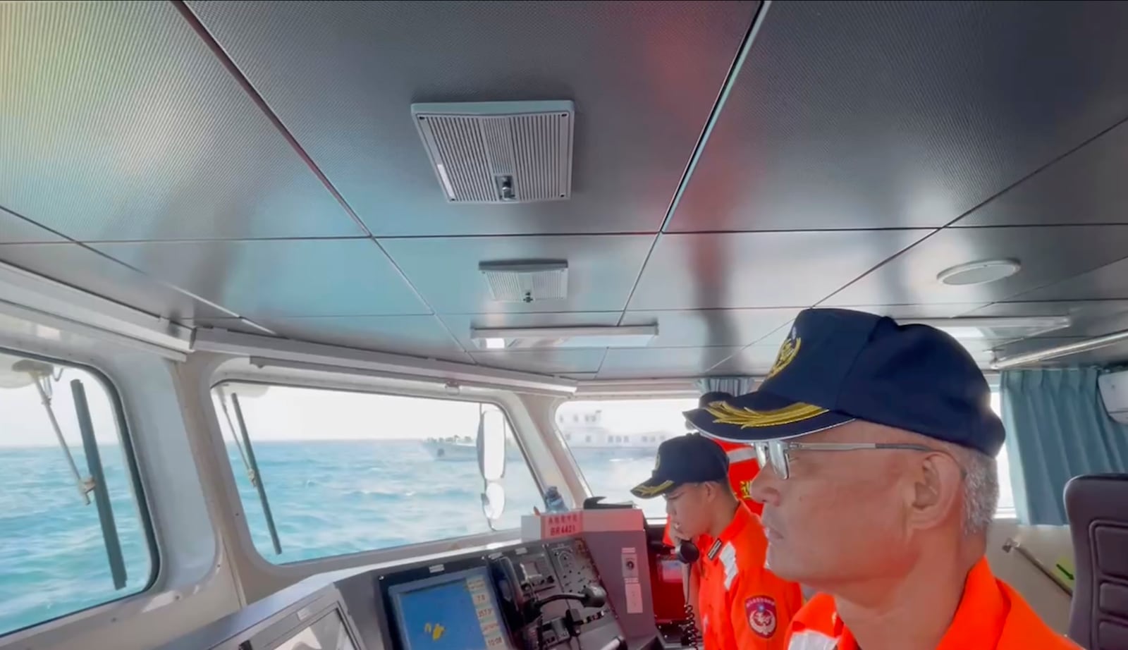 In this screen grab from video released by the Taiwan Coast Guard, Taiwan Coast Guard members track China's Coast Guard boat as it past near the coast of Matsu islands, Taiwan on Monday, Oct. 14, 2024. (Taiwan Coast Guard via AP)