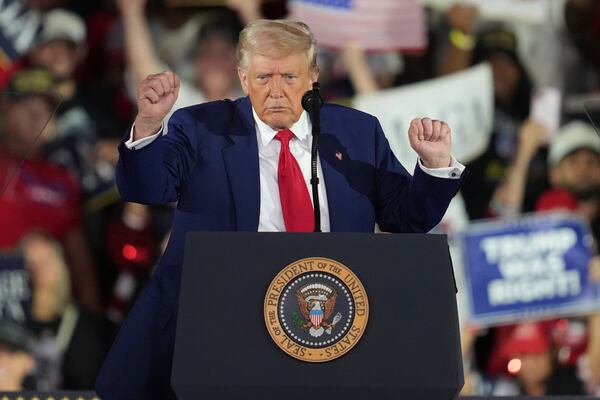 President Donald Trump dances after speaking at Macomb Community College, Tuesday, April 29, 2025, in Warren Mich. (AP Photo/Paul Sancya)