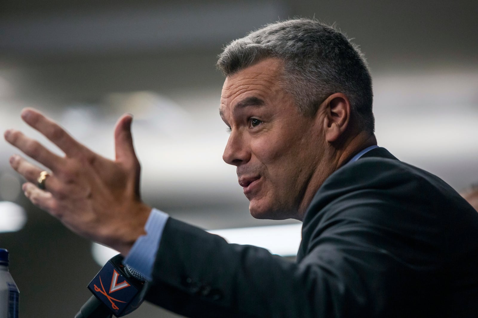 Virginia NCAA college basketball coach Tony Bennett announces his retirement as athletic director Carla Willliams looks on during a press conference in Charlottesville, Va., Friday, Oct. 18, 2024. (Cal Cary/The Daily Progress via AP)