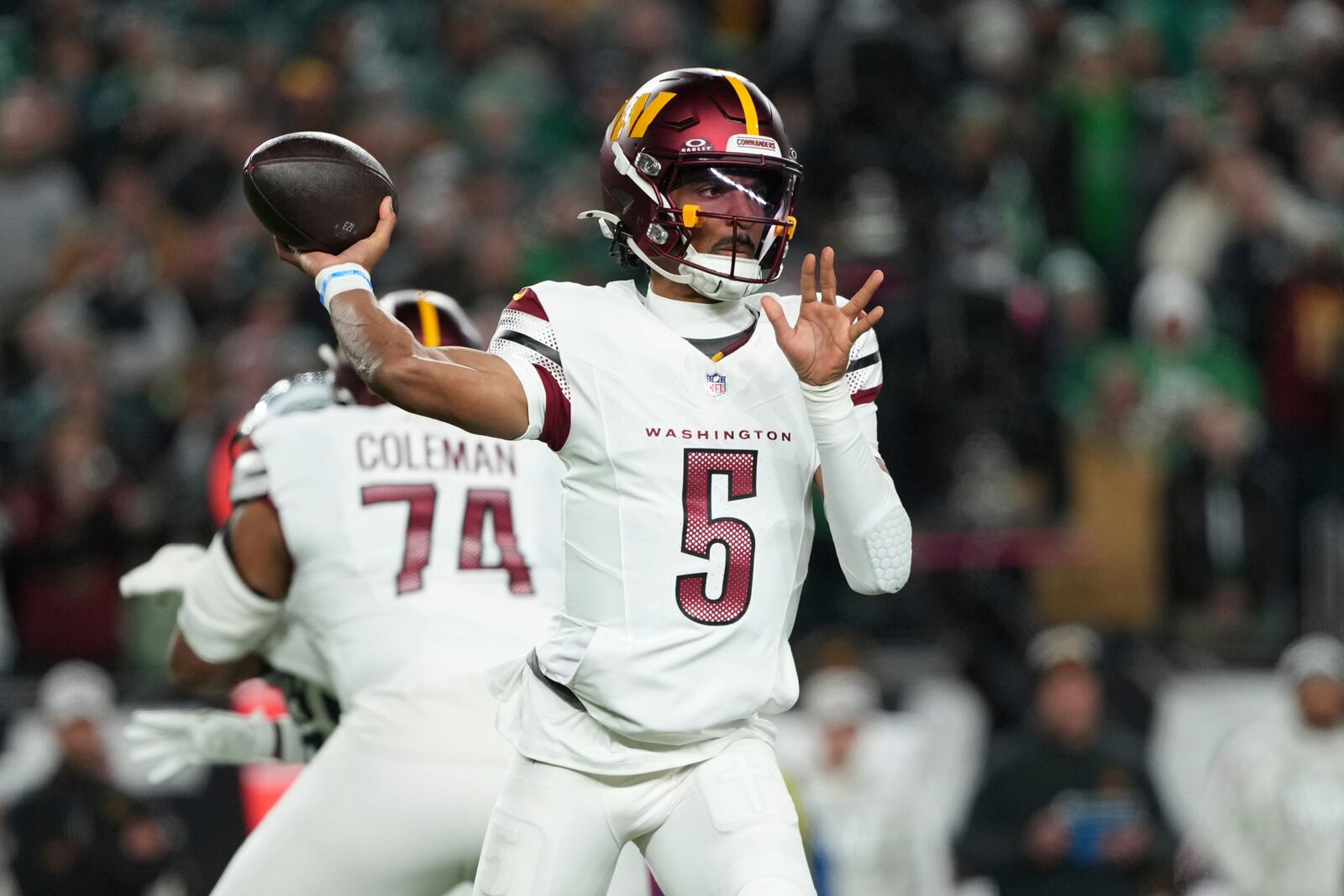 Washington Commanders quarterback Jayden Daniels throws during the first half of an NFL football game against the Philadelphia Eagles Thursday, Nov. 14, 2024, in Philadelphia. (AP Photo/Matt Slocum)