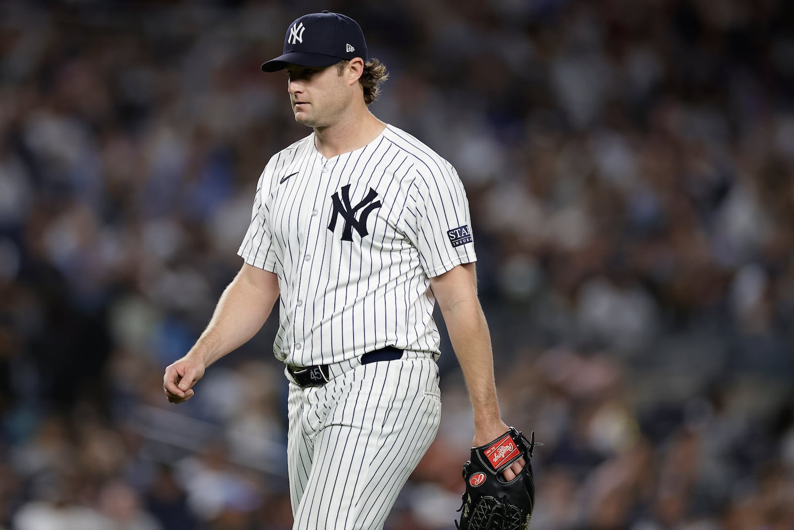 New York Yankees pitcher Gerrit Cole walks off the mound during the sixth inning of Game 1 of the American League baseball division series against the Kansas City Royals, Saturday, Oct. 5, 2024, in New York. (AP Photo/Adam Hunger)