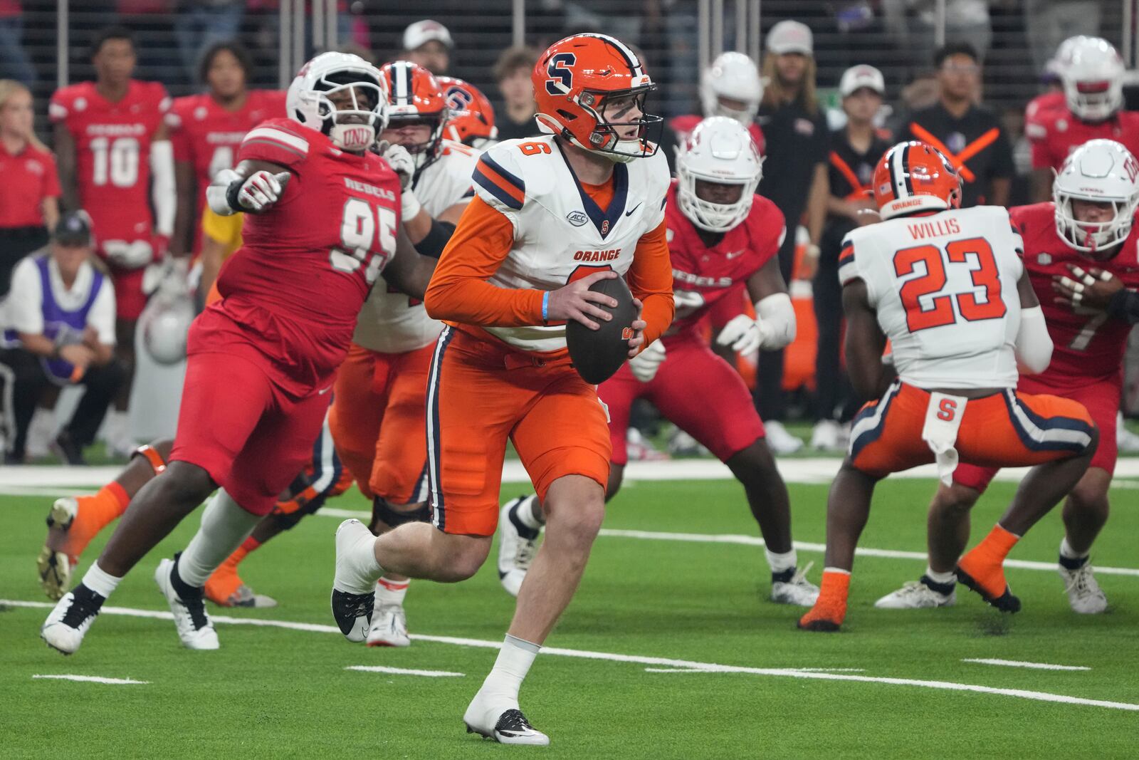 Syracuse quarterback Kyle McCord (6) runs with the ball against UNLV in the first half during an NCAA college football game, Friday, Oct. 4, 2024, in Las Vegas. (AP Photo/Rick Scuteri)