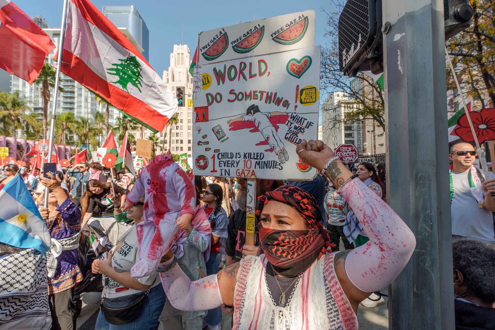 People participate in a rally in support of the Palestinian people downtown Los Angeles on Saturday, Oct. 5, 2024, two days before the anniversary of Hamas-led groups' attack in Israeli territory outside of Gaza on Oct. 7, 2023. (AP Photo/Damian Dovarganes)