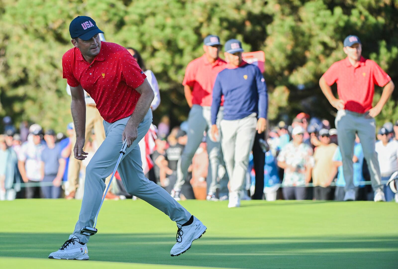 United States team member Keegan Bradley reacts after a putt on the 18th green during a fifth-round singles match at the Presidents Cup golf tournament at Royal Montreal Golf Club, Sunday, Sept. 29, 2024, in Montreal. (Graham Hughes/The Canadian Press via AP)