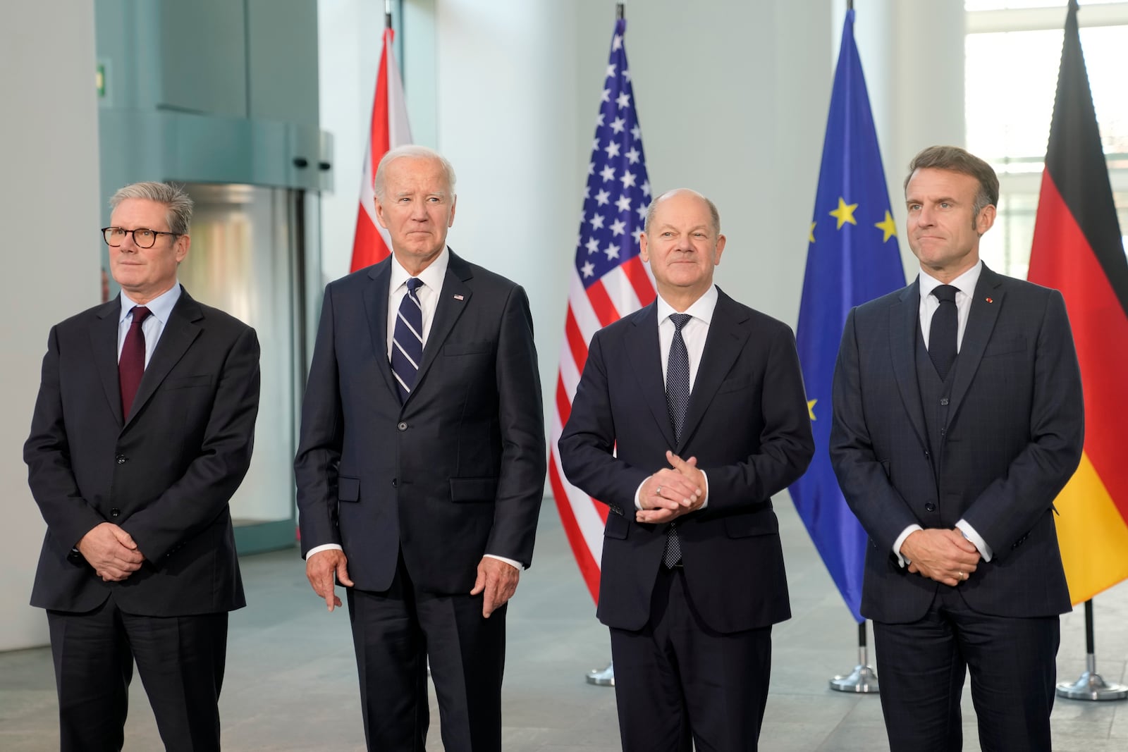 Prime Minister Keir Starmer of the United Kingdom, US President Joe Bide, Chancellor Olaf Scholz of Germany, and President Emmanuel Macron of France, from left, standing together for a Family photo during a meeting at the Chancellery in Berlin, Germany, Friday, Oct. 18, 2024. (AP Photo/Markus Schreiber)