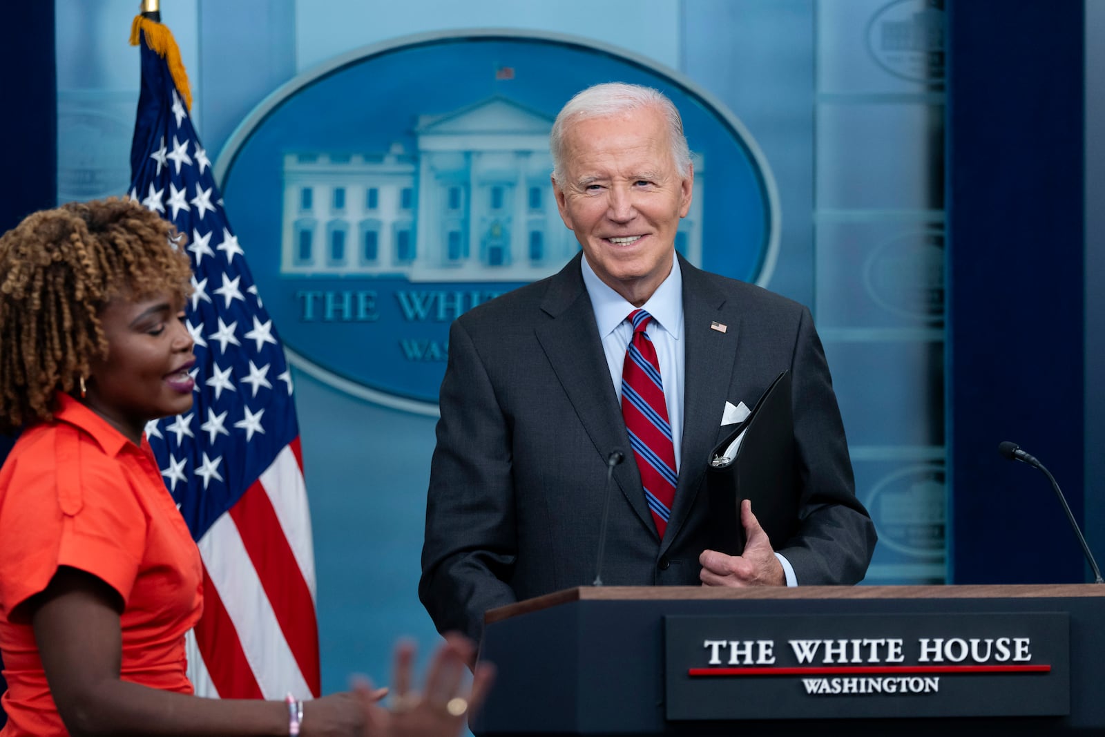 President Joe Biden, accompanied by Press Secretary Karine Jean-Pierre, makes a joke as he speaks at the top of the daily press briefing, Friday, Oct. 4, 2024, at the White House in Washington. (AP Photo/Ben Curtis)