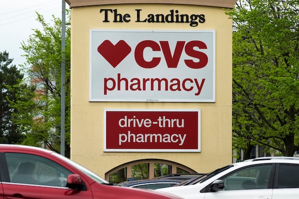 FILE - CVS pharmacy and drive-thru signs are seen outside of a CVS store in Park Ridge, Ill., April 29, 2024. (AP Photo/Nam Y. Huh, File)