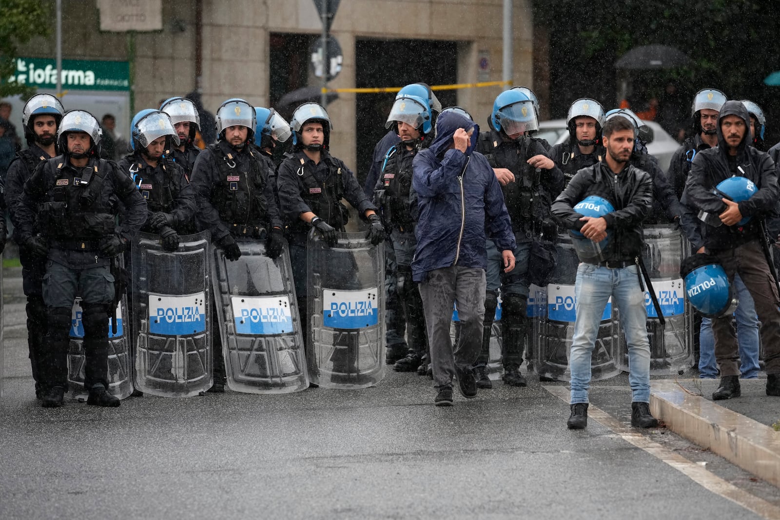 Italian Police officers patrol during a protest in Rome, Saturday, Oct. 5, 2024. Pro-palestinians people take to the street in an unauthorised march in the centre of Rome two days ahead of the first anniversary of the Oct. 7. (AP Photo/Andrew Medichini)