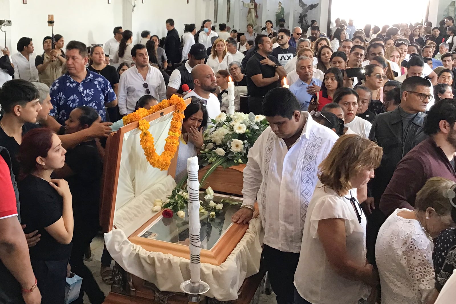 Supporters of slain Mayor Alejandro Arcos attend a mass service one week after he took office, in Chilpancingo, Mexico, Monday, Oct. 7, 2024. (AP Photo/Alejandrino Gonzalez)