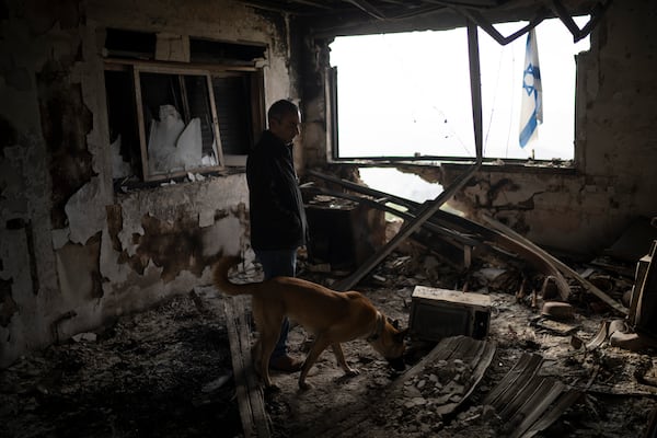 Naor Shamia, manager of the kibbutz emergency unit, stands at room of a house that was hit by a rocket fired from Lebanon, in the Kibbutz Manara, northern Israel, Thursday, Nov. 28, 2024. (AP Photo/Leo Correa)