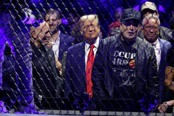 President-elect Donald Trump stands next to CEO of UFC Dana White, left, and Elon Musk, right, at the UFC 309 mixed martial arts event Saturday, Nov. 16, 2024, in New York. (AP Photo/Adam Hunger)