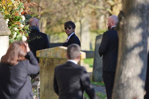 Former One Direction band member Louis Tomlinson arrives for the funeral service of One Direction singer Liam Payne at St Mary's Church in Amersham, Buckinghamshire, England, Wednesday Nov. 20, 2024. (Jonathan Brady/PA via AP)