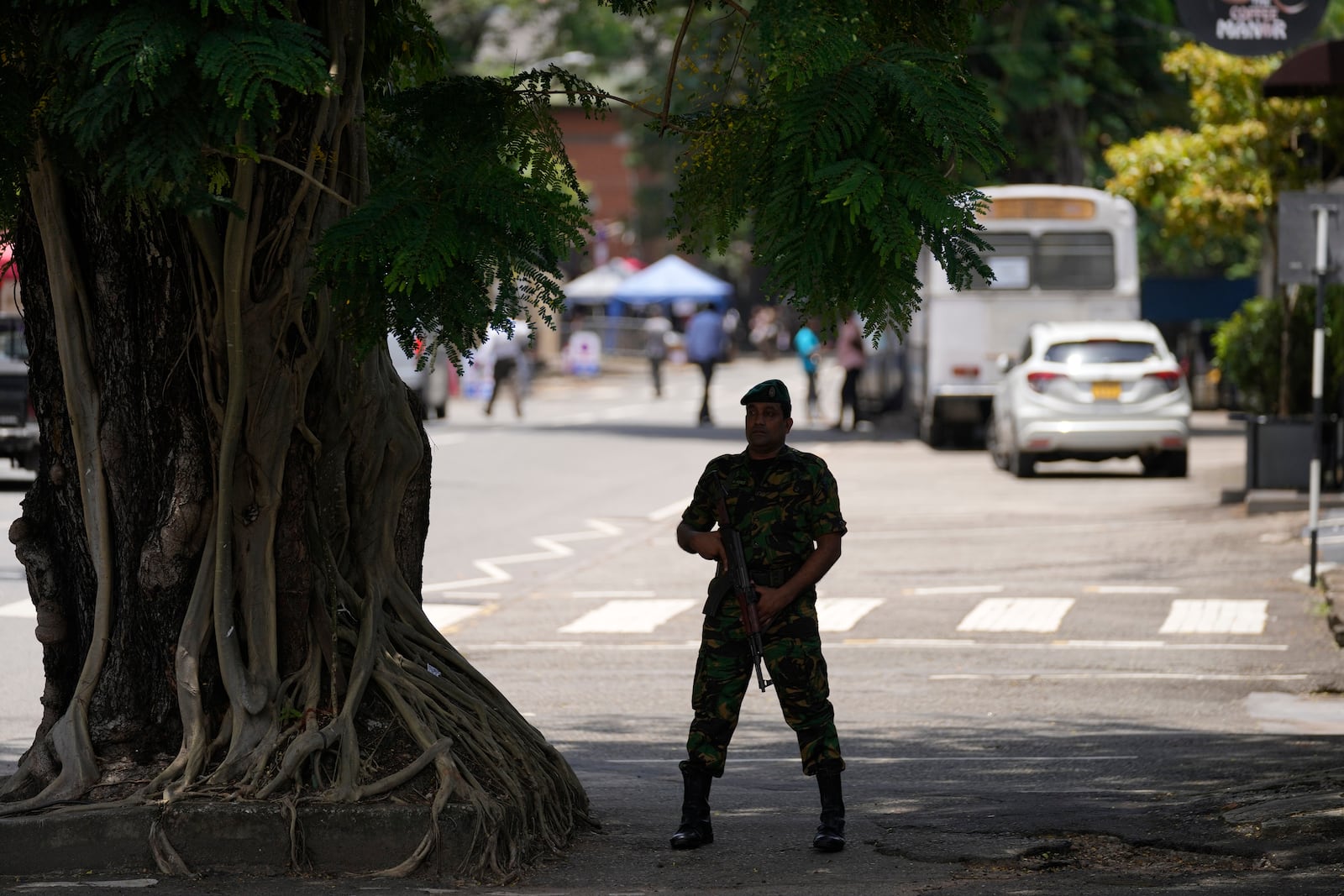 A police officer stands guard outside a polling material distribution center ahead of the presidential election, in Colombo, Sri Lanka, Friday, Sept. 20, 2024. (AP Photo/Eranga Jayawardena)