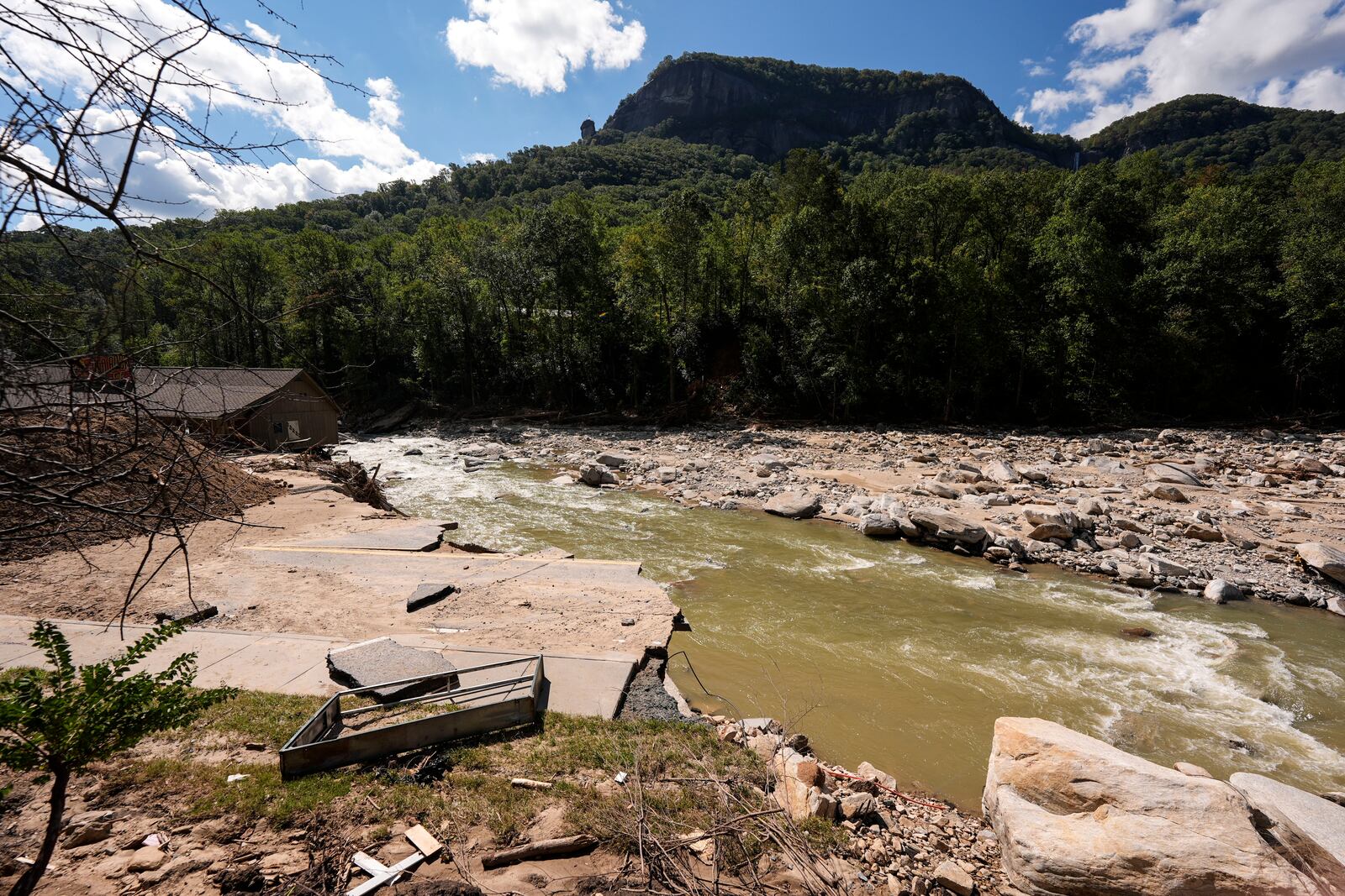 A washed out road is seen in the aftermath of Hurricane Helene, Wednesday, Oct. 2, 2024, in Chimney Rock Village, N.C. (AP Photo/Mike Stewart)