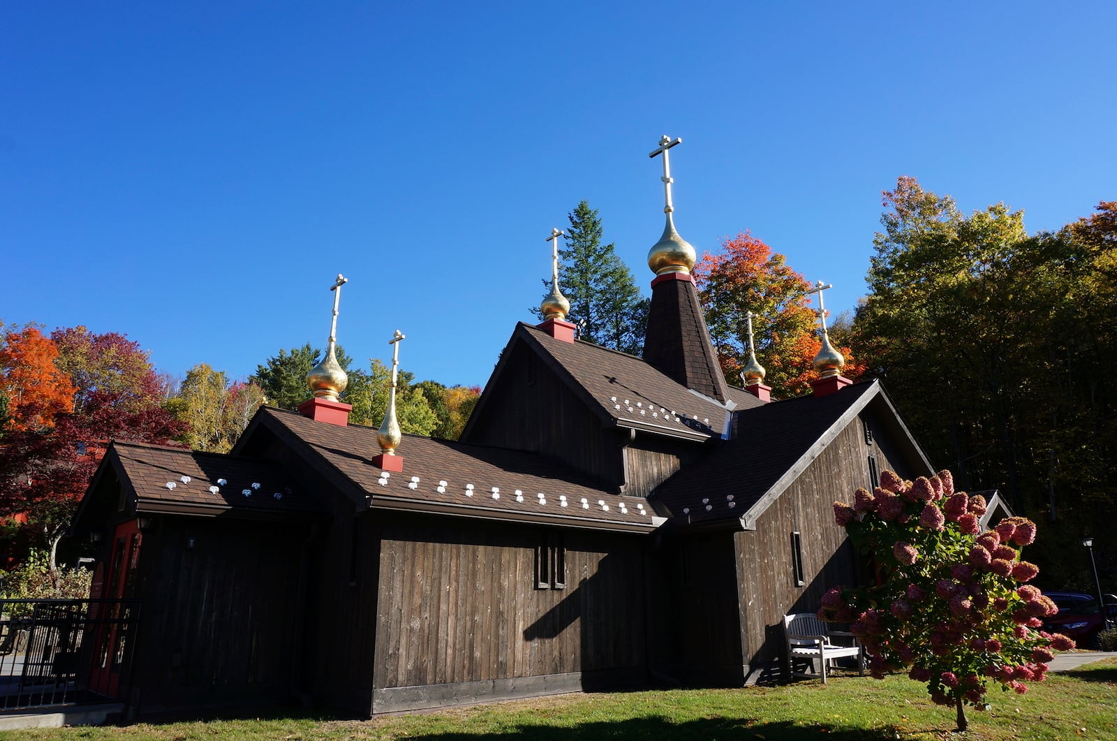 The Church of Holy Transfiguration, built by monks in 1970, stands on the campus of New Skete, a Christian Orthodox monastery renowned for dog breeding and training programs outside Cambridge, N.Y., on Oct. 12, 2024. (AP Photo/Giovanna Dell’Orto)