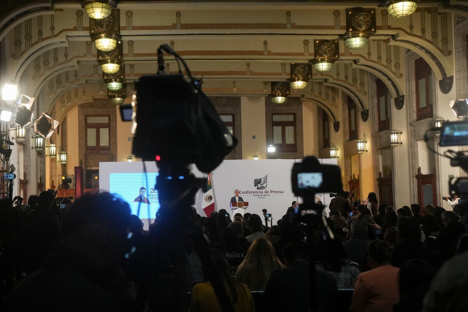 Mexican President Claudia Sheinbaum gives a media briefing from the National Palace in Mexico City, Wednesday, Oct. 2, 2024, the morning after her inauguration. (AP Photo/Fernando Llano)