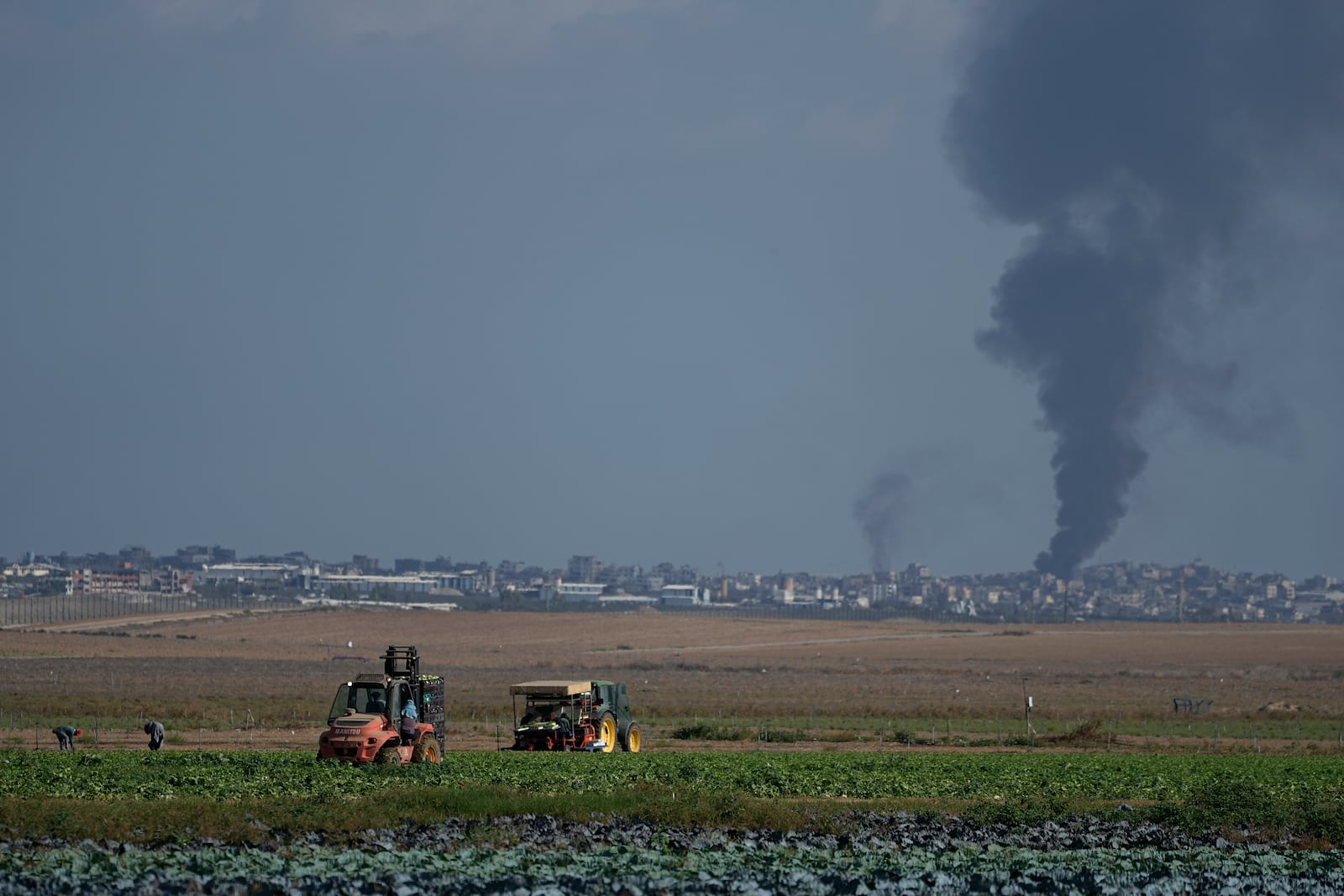 Smoke from Israeli bombardment rises from the Gaza Strip, as seen from southern Israel, Wednesday, Oct. 16, 2024. (AP Photo/Tsafrir Abayov)