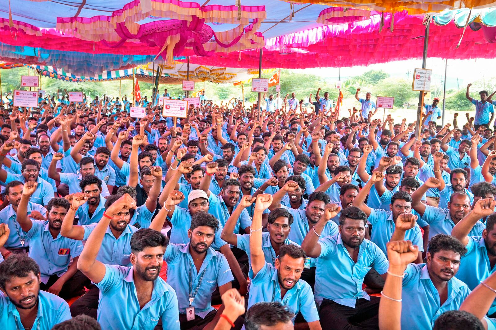 Samsung workers who are on strike shout slogans during a protest near their plant in Sriperumbudur, on the outskirts of Chennai, India, Tuesday, Sept. 24, 2024. (AP Photo/Mahesh Kumar A.)