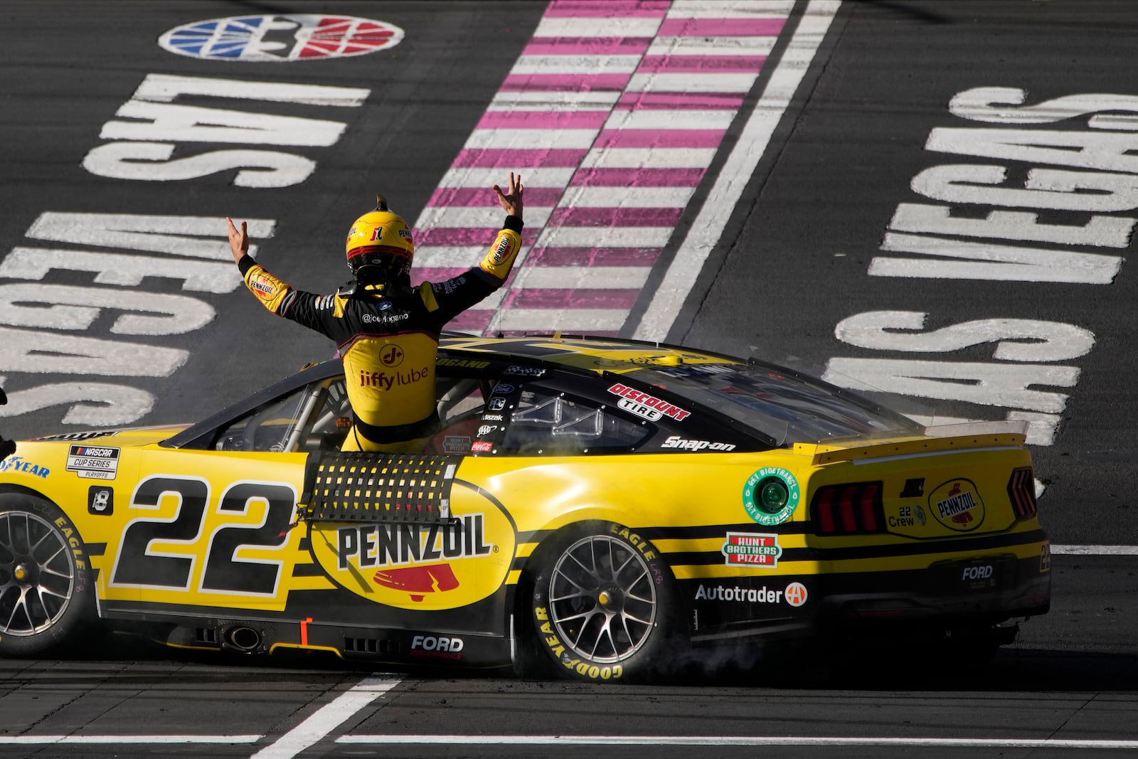 NASCAR Cup Series driver Joey Logano (22) celebrates after winning a NASCAR Cup Series auto race Sunday, Oct. 20, 2024, in Las Vegas. (AP Photo/John Locher)